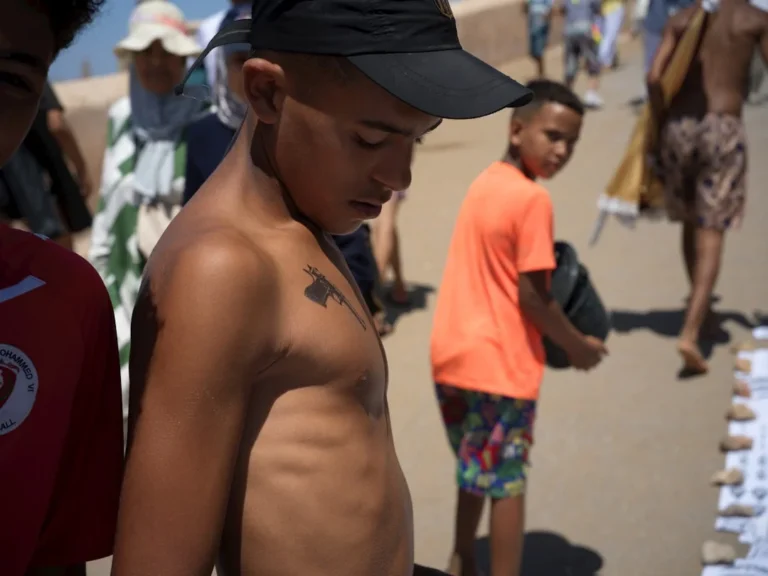 Young boy looking down on a sunny day